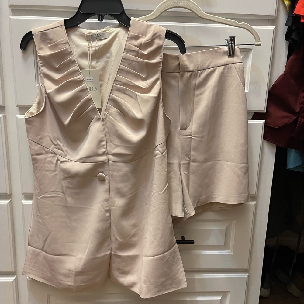 NWT vest and short set.